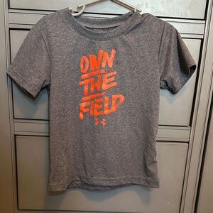 Under Armour Kids Tee with Orange Graphic.  Own The Field